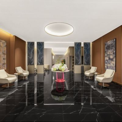 Full view of Zhuhai Meichen Hotel lobby with large minimalist textured wall paintings