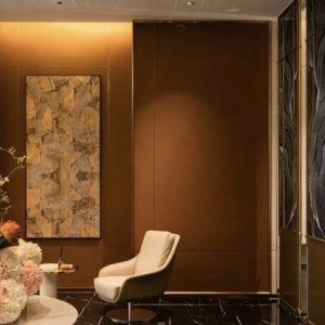 Minimal abstract textured wall art installation in hotel lobby lounge area of Zhuhai Meichen Hotel