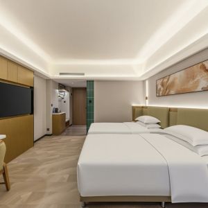 zhuhai meichen hotel guest room interior with minimalist abstract wall painting above bed